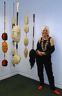 [Carolyn Leigh at MOCA-Tucson with her 5 piece fiber sculpture, Aeries Cycle: 28k]